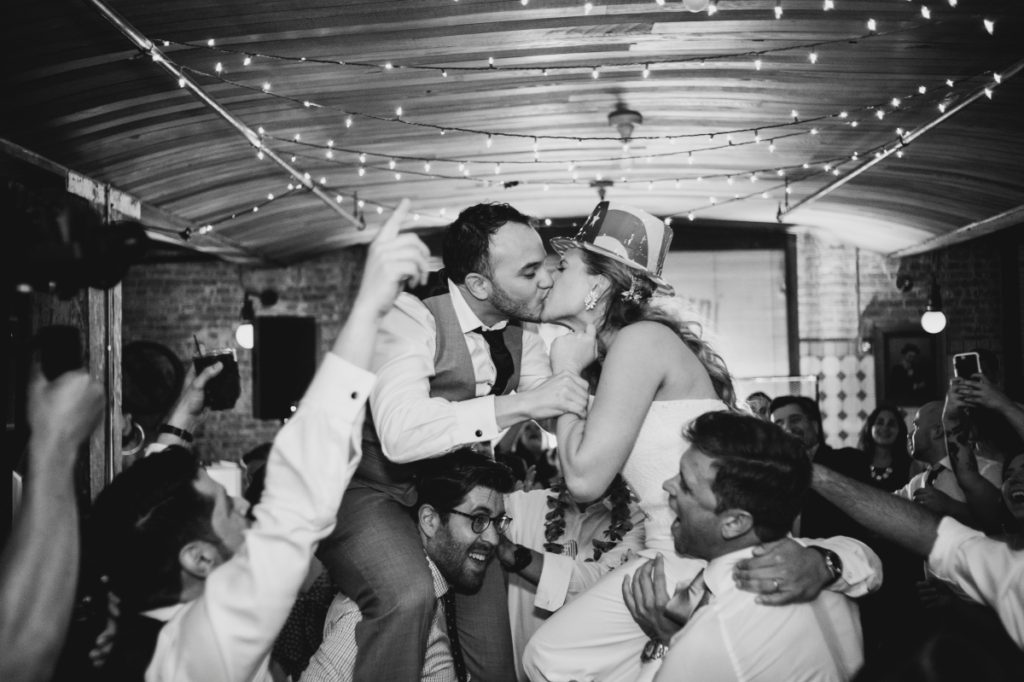 Kolo Klub Wedding Hoboken NJ NY NYC W Hotel rustic string lights wooden interior dancing reception candid moment funny groom kiss