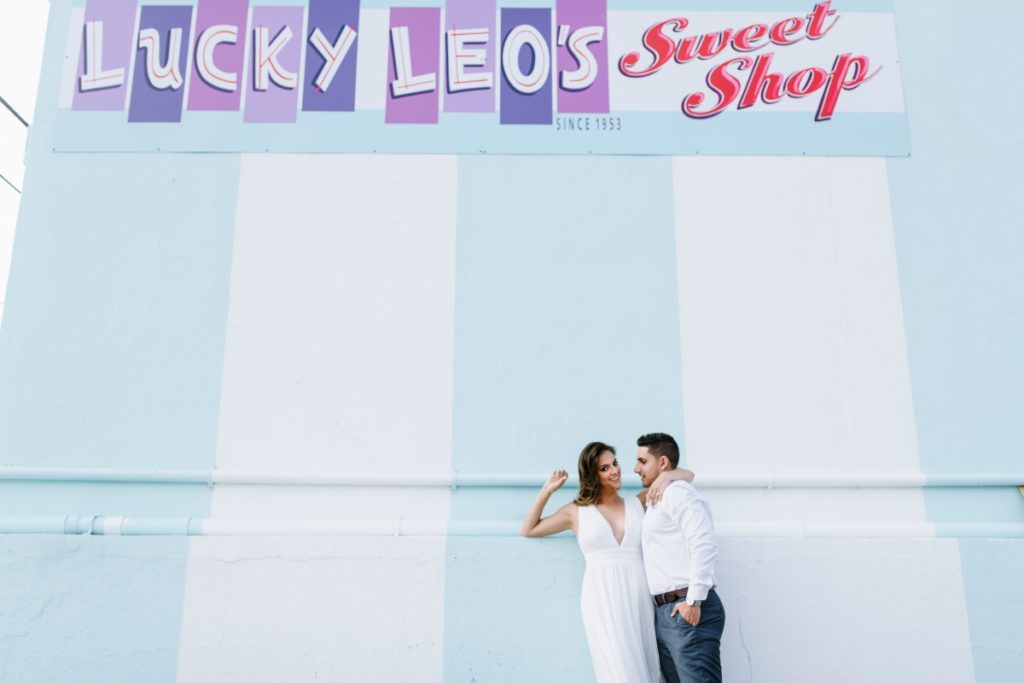 Seaside Heights Boardwalk Summer Ocean County Beach Engagement Session July Love Save the Dates Carnival Games Spin the Wheel Candy Lucky Leo's sweet shop kiss Casino Pier Breakwater Beach Water Park Amusement Park