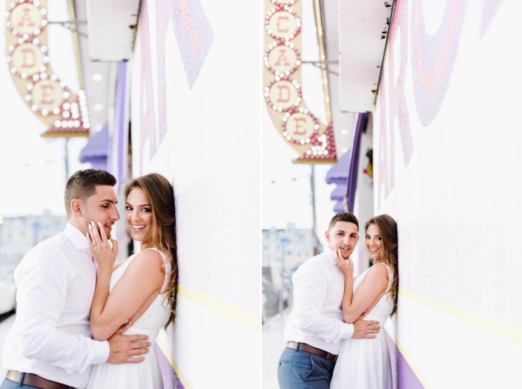 Seaside Heights Boardwalk Summer Ocean County Beach Engagement Session July Love Save the Dates Carnival Games Spin the Wheel Candy Lucky Leo's kiss arcade Casino Pier Breakwater Beach Water Park Amusement Park