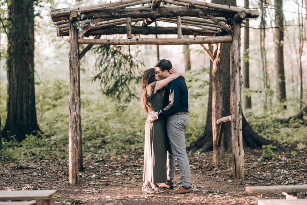 wooden pergola kiss trees forest trails deserted village of feltville watchung reservation mountainsidenj newprovidencenj autumn fall​engagement session rustic​ ​wedding​ ​ ​​