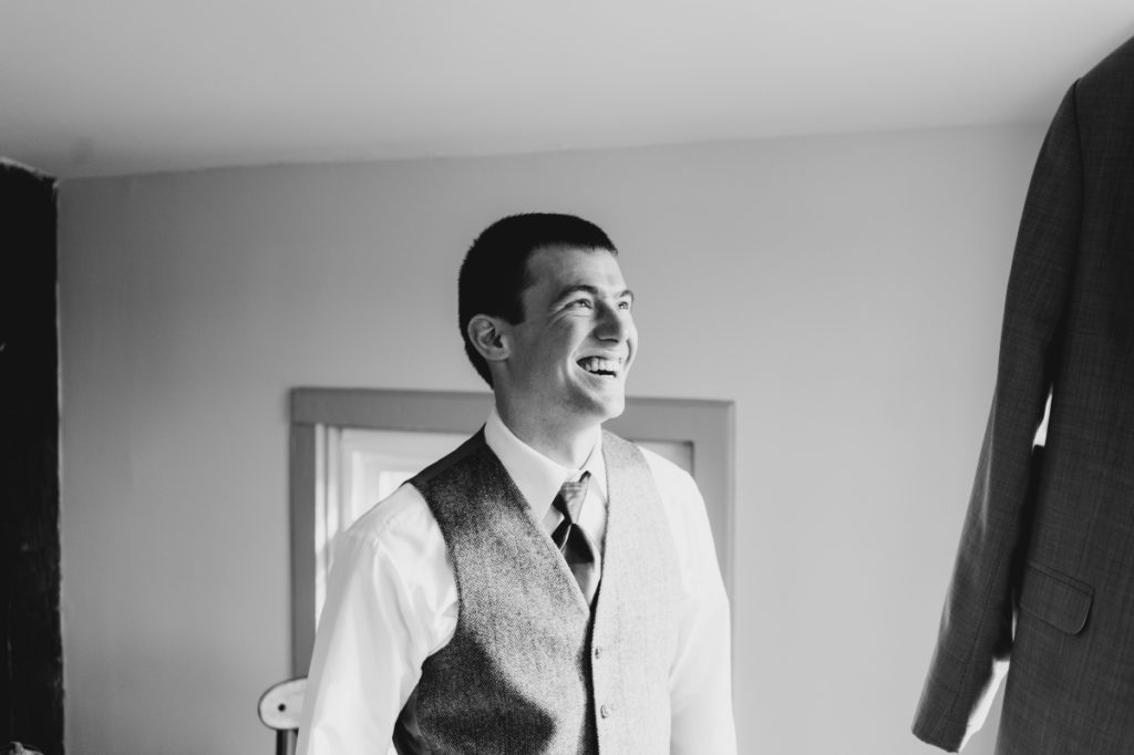 black and white candid groom ​David's Country Inn January Wedding Stephen's State Park Winter time wedding east coast photographers love story new jersey montclair bloomfield bloomfield local pinterest vintage the knot nj wedding photographer wedding style love greenweddingshoes junebugweddings engagement session she said yes how they asked