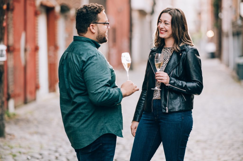 champagne alleyway exposed brick fall autumn september engagement session Hoboken Lackawanna Train Station  NY new york new york wedding east coast photographers love story new jersey