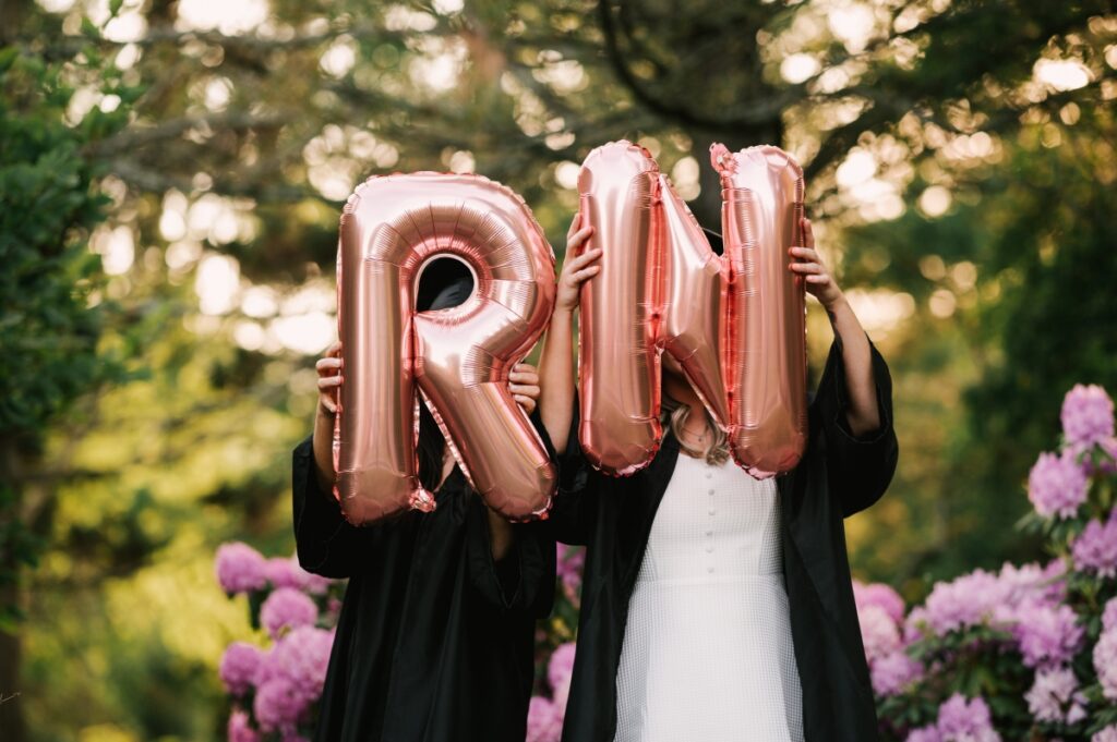 skylands manor nurse graduation session RN balloons cap and gown congrats grad may june sisters