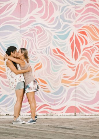 asbury park beach boardwalk summer august engagement session same sex couple lesbian lgbtqia