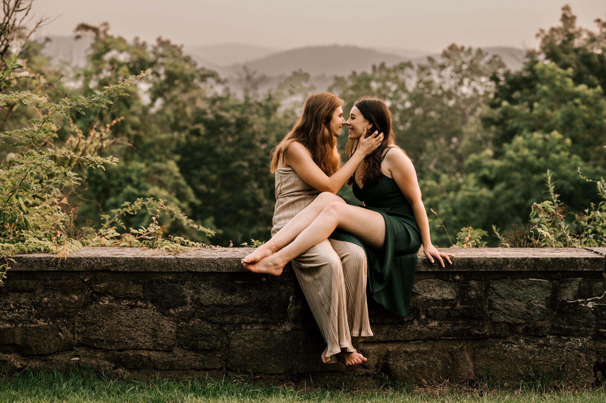 same sex female couple at skylands manor new jersey engagement session in ringwood in july. summer time warmth with views of the mountain ridges