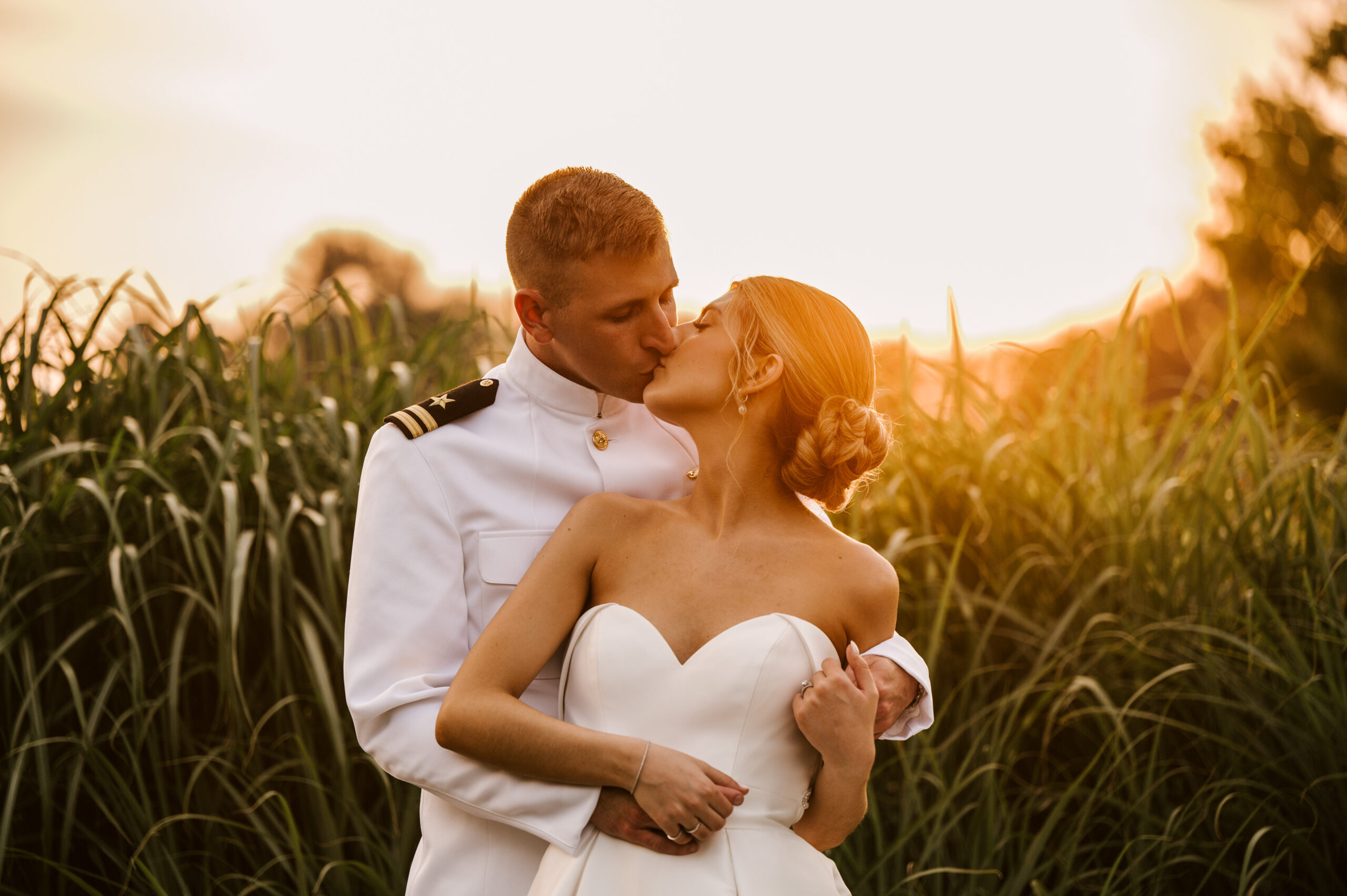 romatnic wedding at Indian Trail Club in franklin lakes New Jersey, bride and groom kissing at golden hour. groom US Navy