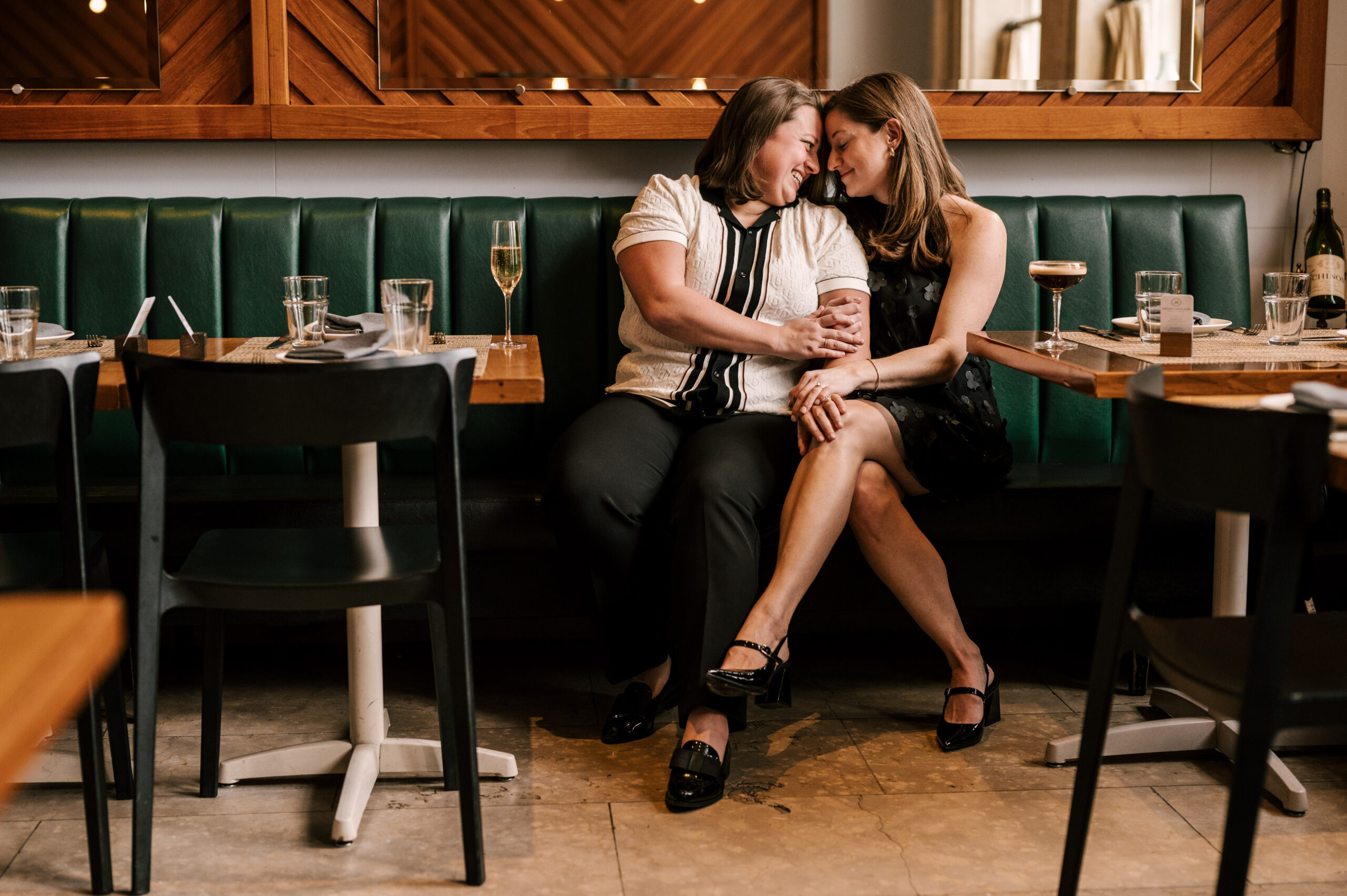 same sex couple brides having a drink at jockey hollow bar and kitchen in Morristown New Jersey
