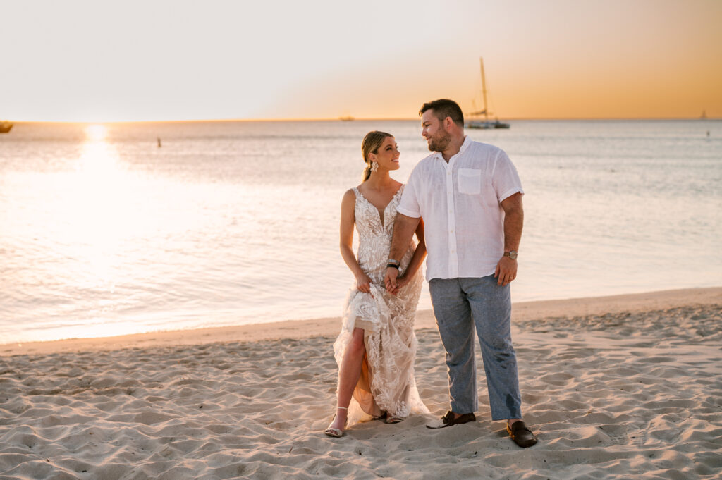 bride and groom at sunset on beach at summertime tropical island destination wedding at Aruba Marriott Resort and Stellaris Casino