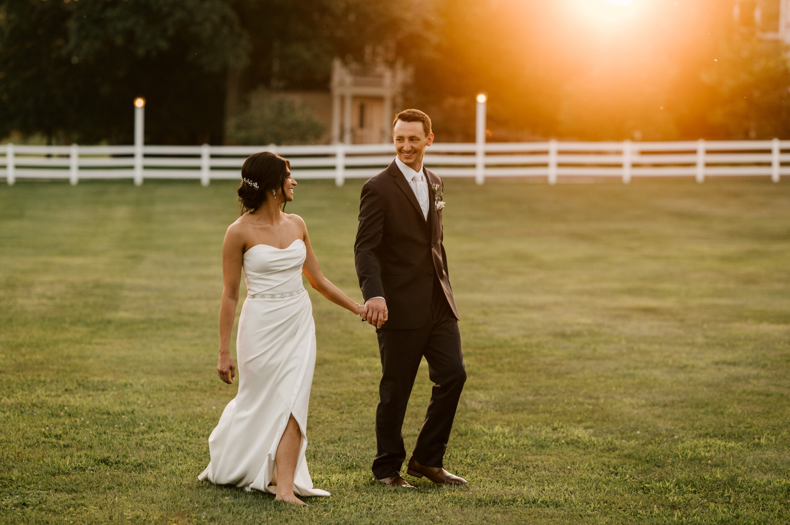 Bride and groom bask in the glow of sunset at The Ryland Inn in whitehouse station New Jersey on their wedding day
