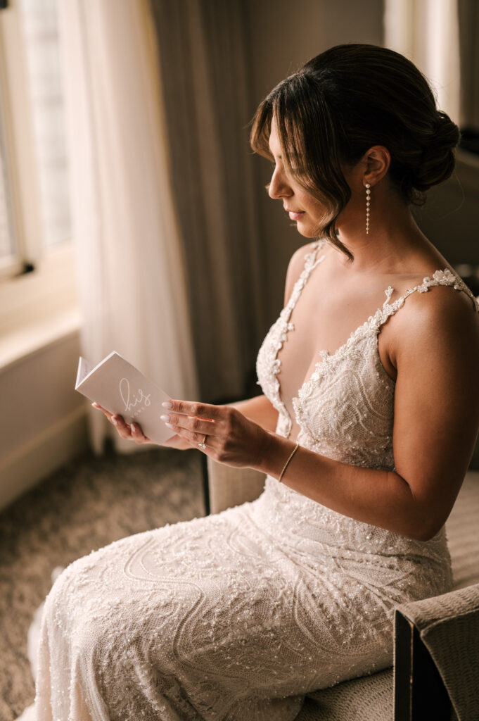 The bride reading the groom’s vows before the first look at Battello in Jersey City.