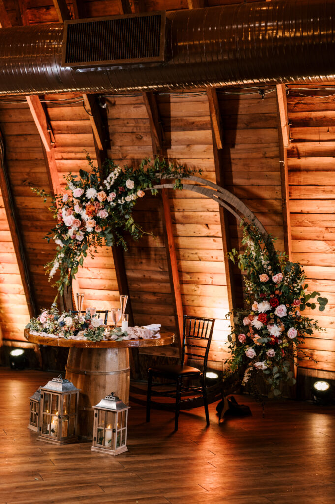 The sweetheart table for the newlyweds at the reception at The Barn at Perona Farms.