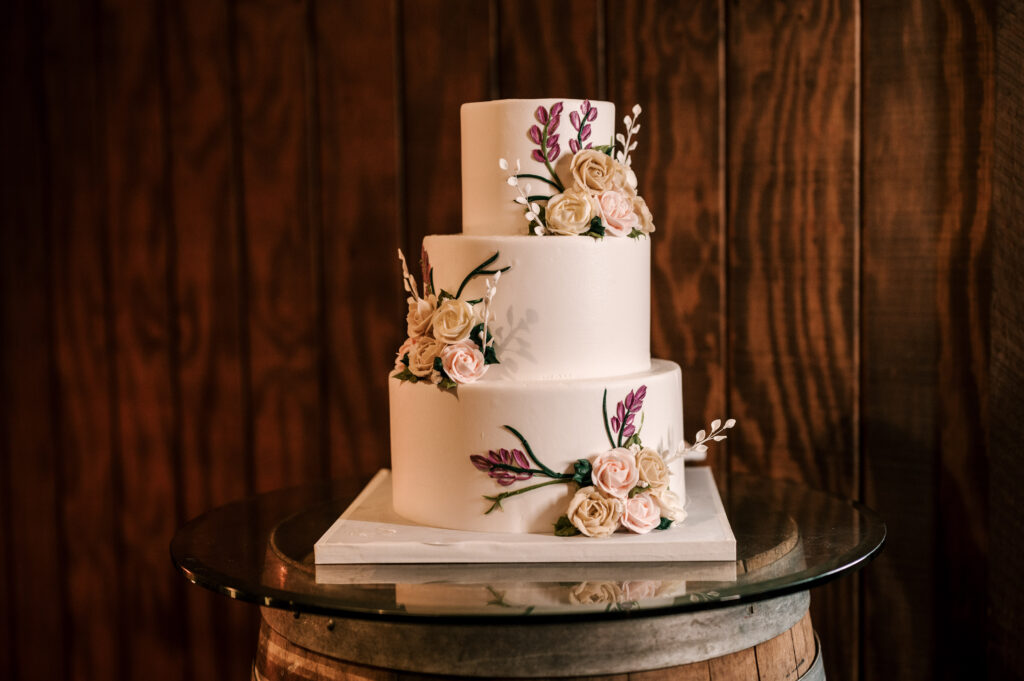 The couple's wedding cake for the reception at The Barn at Perona Farms.
