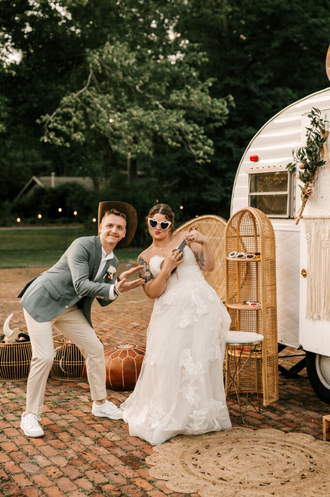 The couple posing in front of the Metro Photobus.
