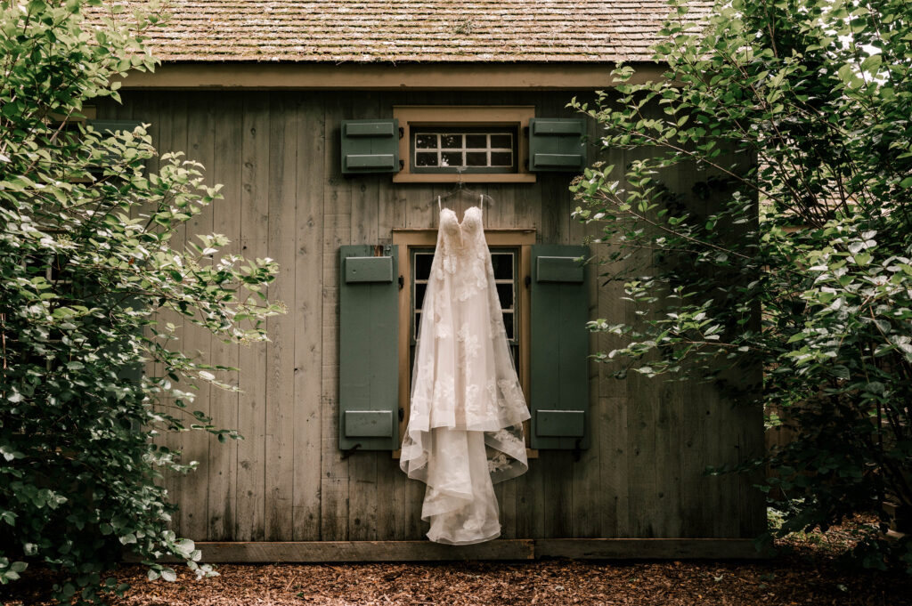 The bride's dress hanging outside on a windowsill at Waterloo Village.