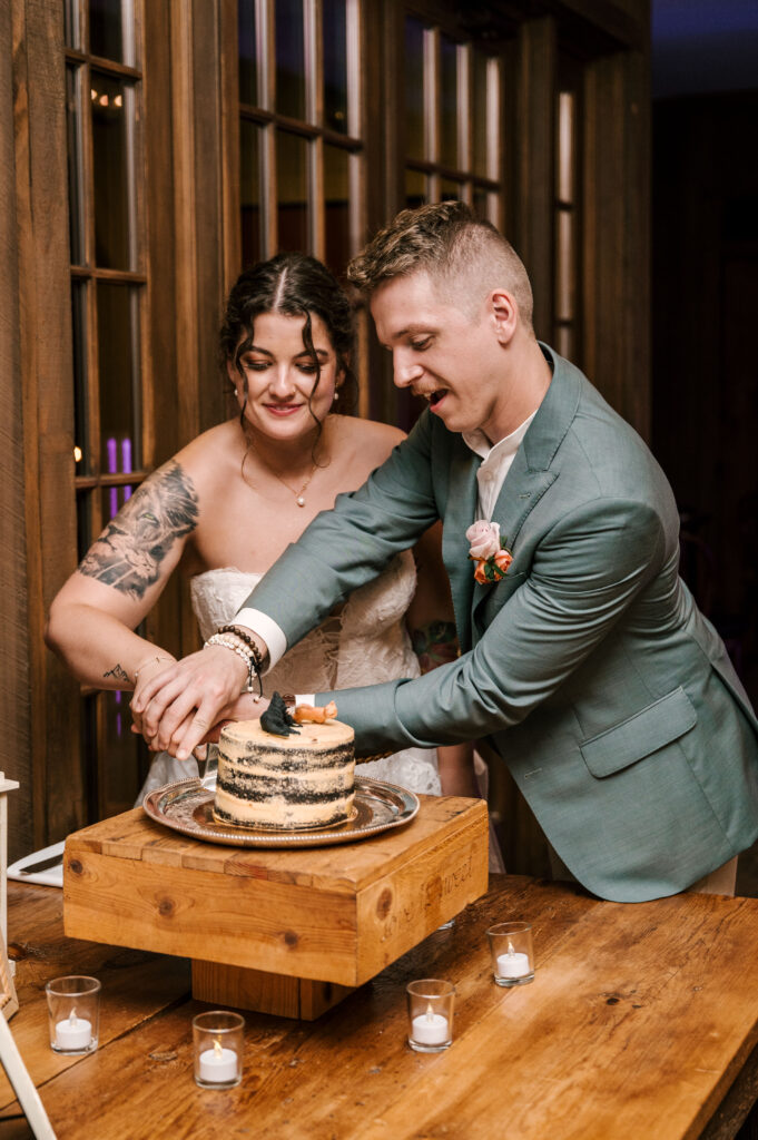 The bride and groom cutting the cake at their reception at Waterloo Village.