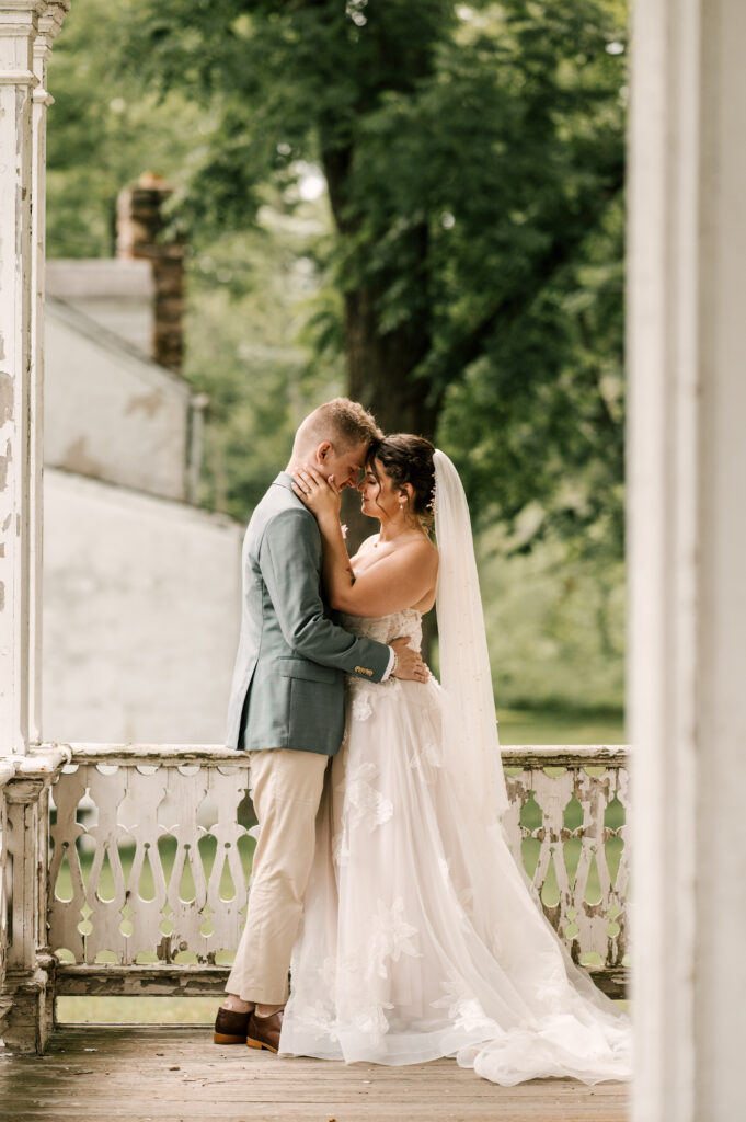 The couple enjoying an intimate moment as their foreheads touch at Waterloo Village.