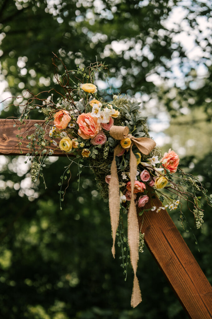 The florals on the wedding arbor for the ceremony at Waterloo Village.