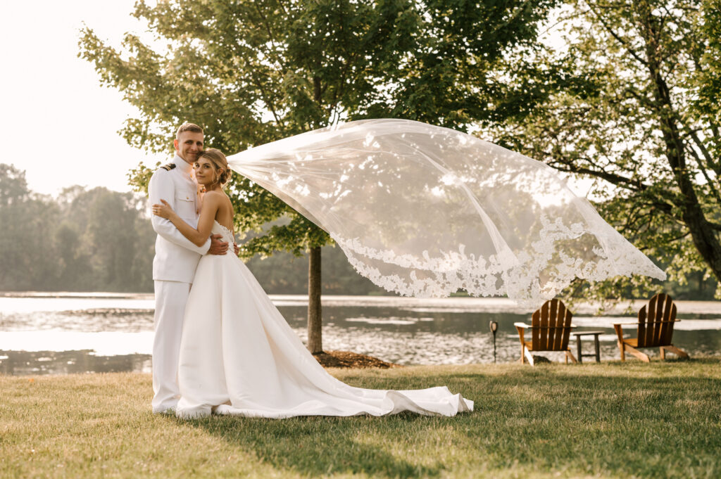 Veil toss at sunset of bride and groom at Indian Trail Club wedding venue in New Jersey