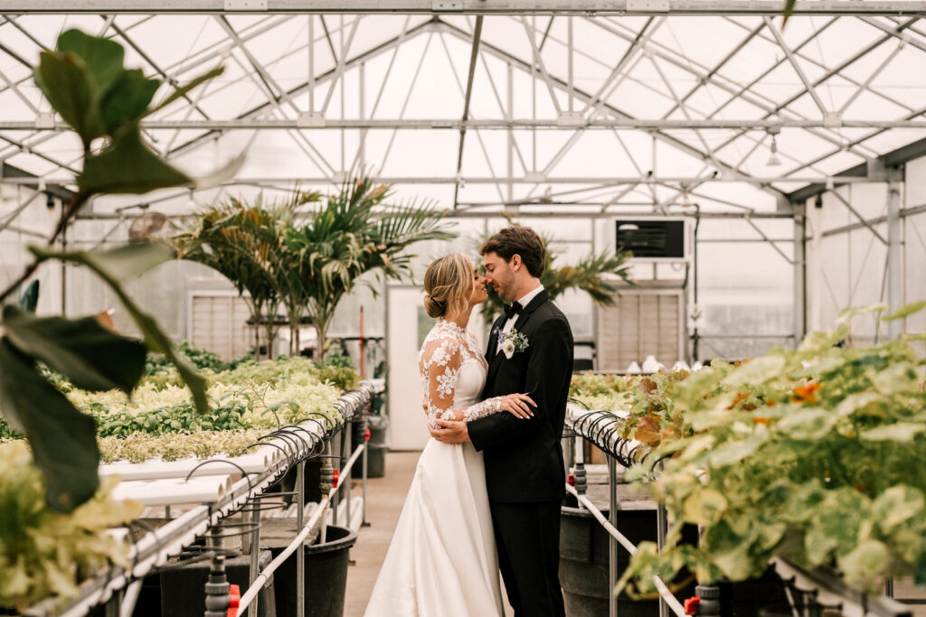 bride and groom in greenhouse at perona farms