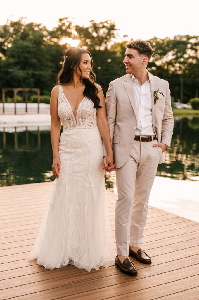 bride and groom on dock at sunset at Rock Island Lake Club