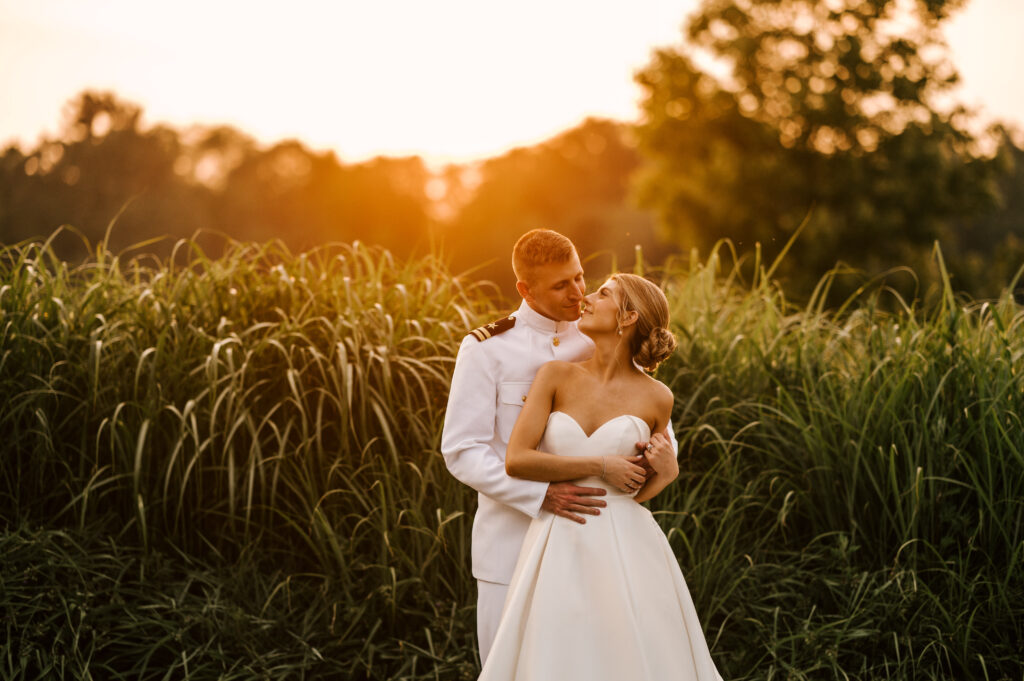 couple embraces during golden hour at indian trail club