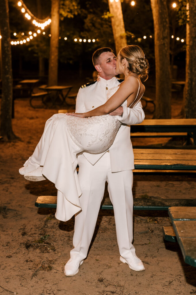 bride and groom night shot kissing at Indian trail club