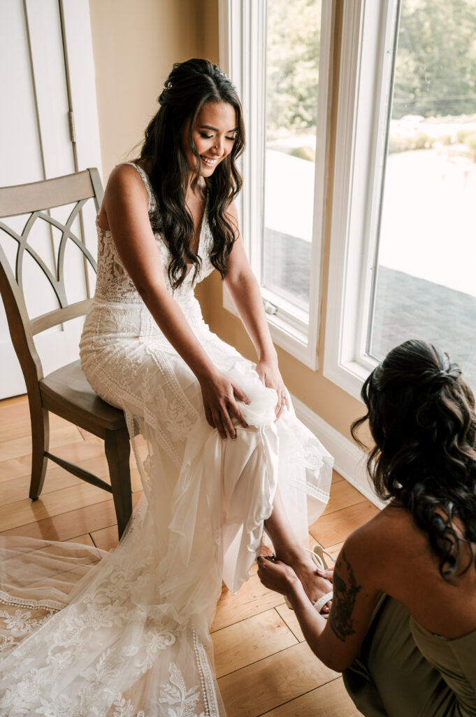 bride getting dressed in suite at Rock Island Lake Club