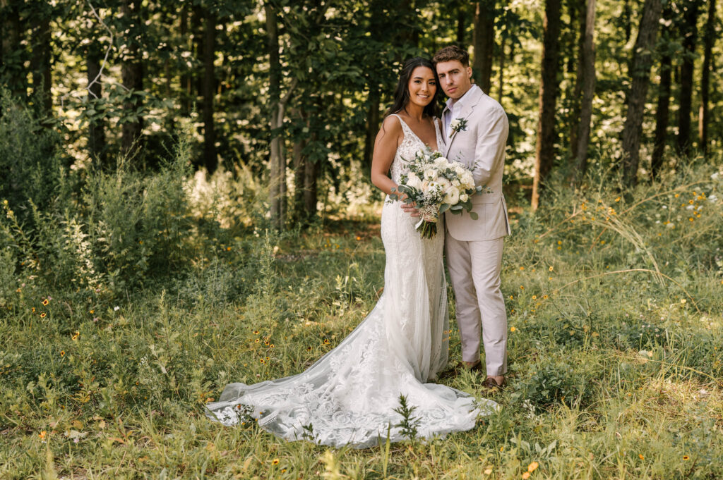 bride and groom  in meadow at Rock Island Lake Club