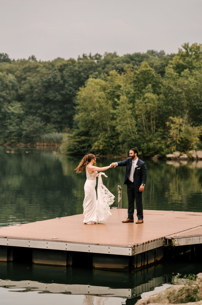 The bride and groom dancing on the dock at Rock Island Lake Club.