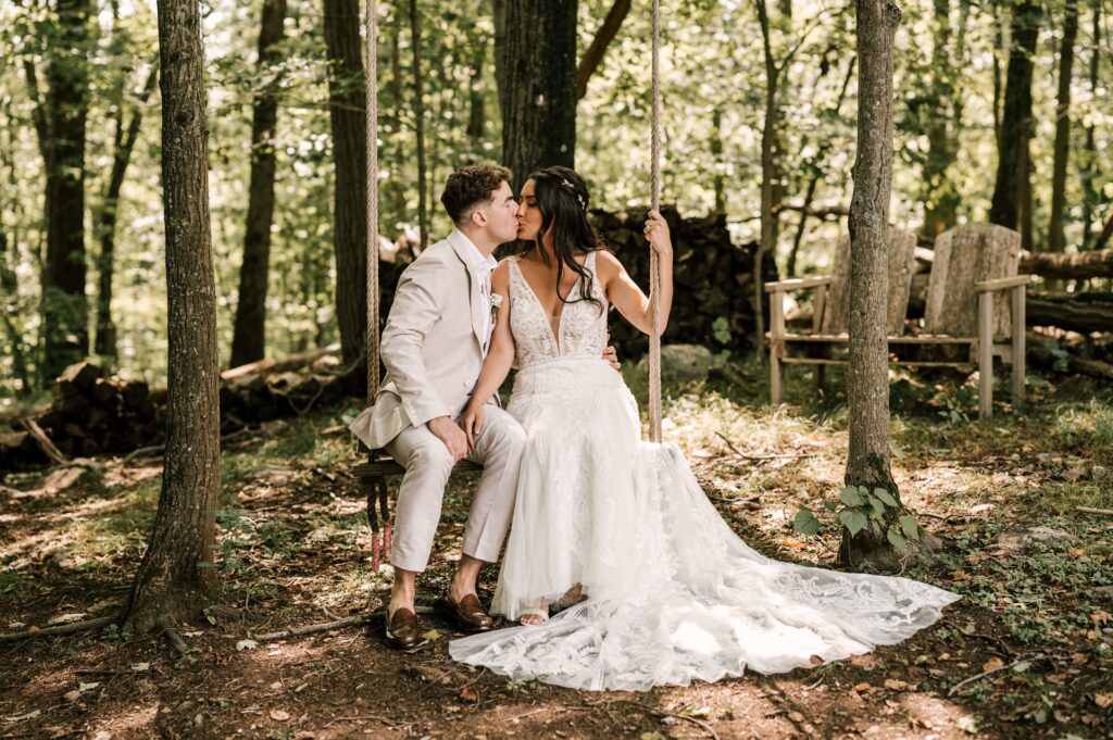 bride and groom on the swings at Rock Island Lake Club