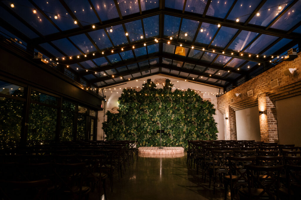 perona farms refinery atrium ceremony space at night