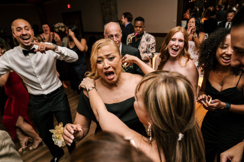 The wedding guests dancing and enjoying their time on the dance floor at Perona Farms Reserve.