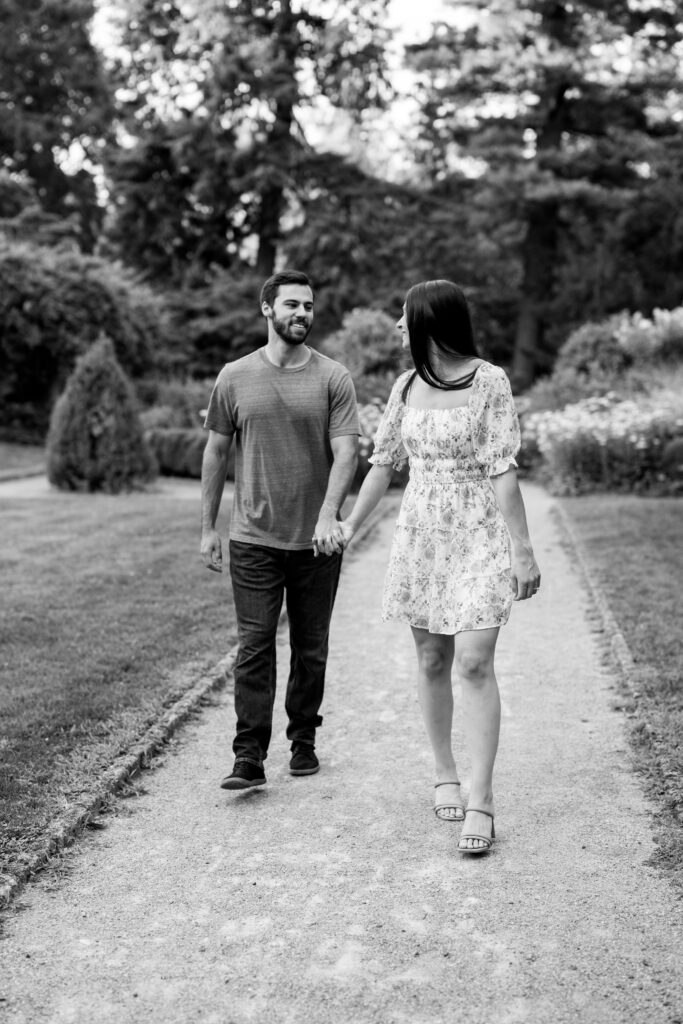 black and white photo with bride to be looking at future husband