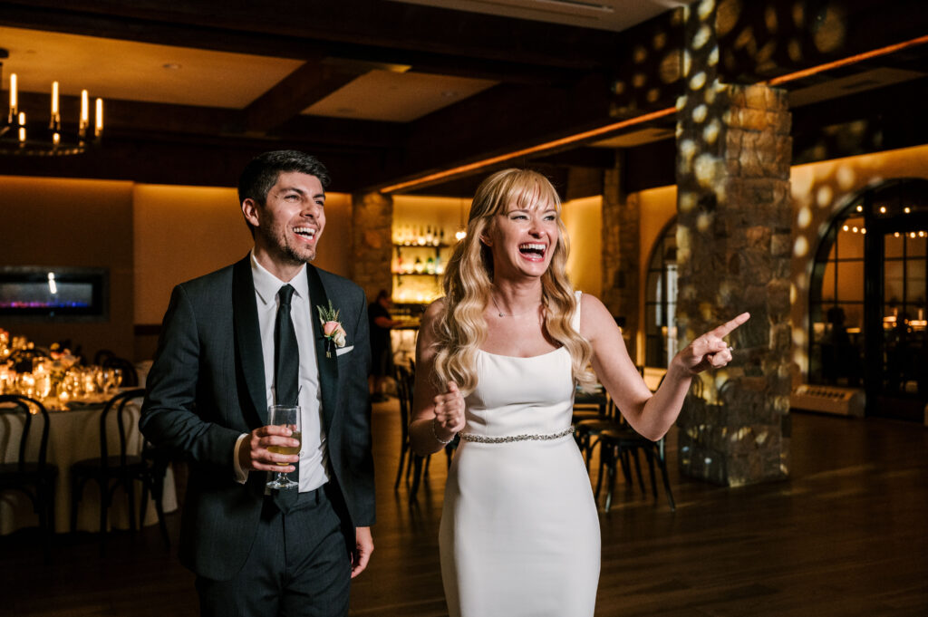 bride and groom admiring the reception space at perona farms in nj for their fall wedding