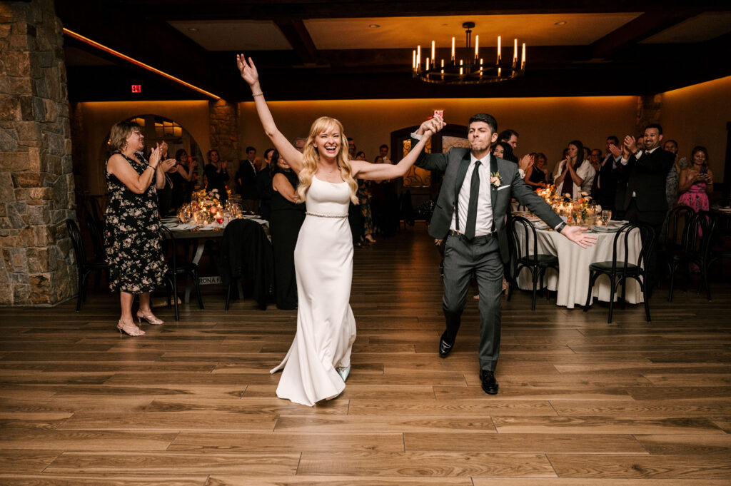 bride and groom entering wedding reception during september nj wedding