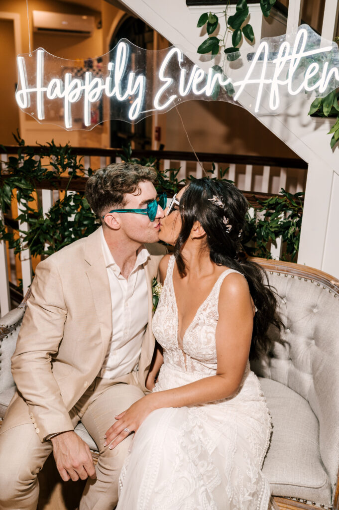 bride and groom sharing a kiss at the end of their wedding day at rock island lake club in nj 