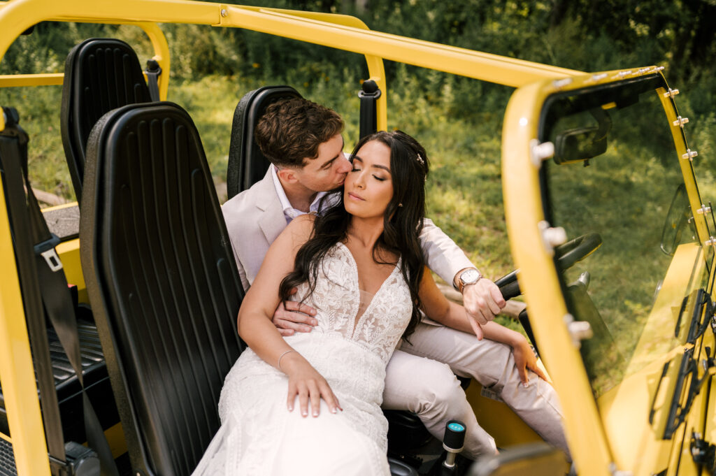 bride and groom in yellow jeep at rock island lake club in nj for their summer wedding