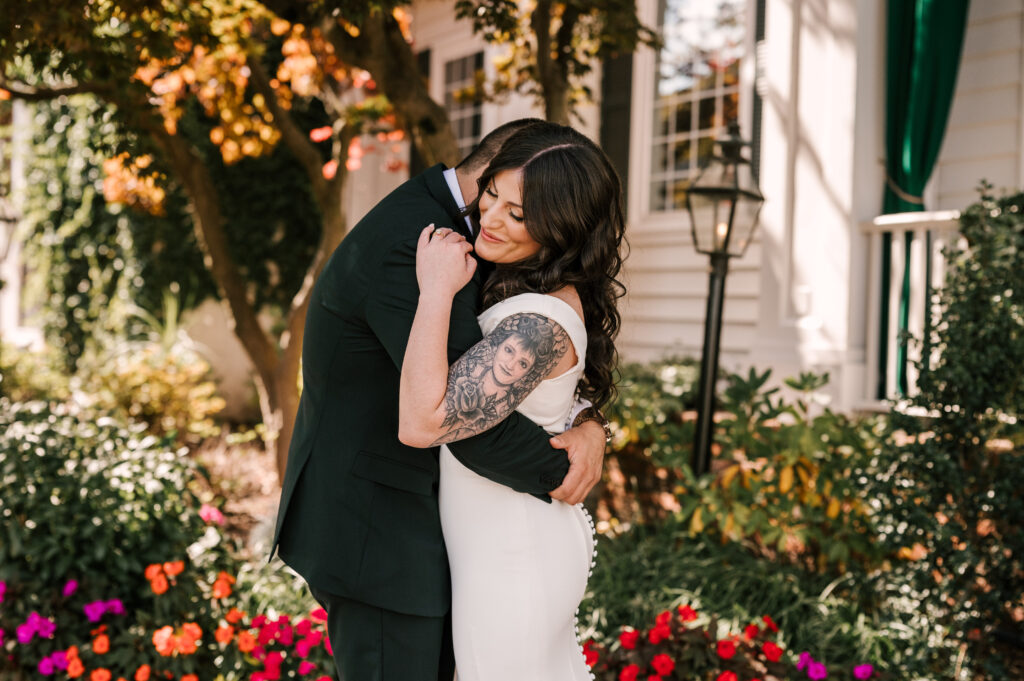 bride and groom hugging during first look at david's country inn in nj 
