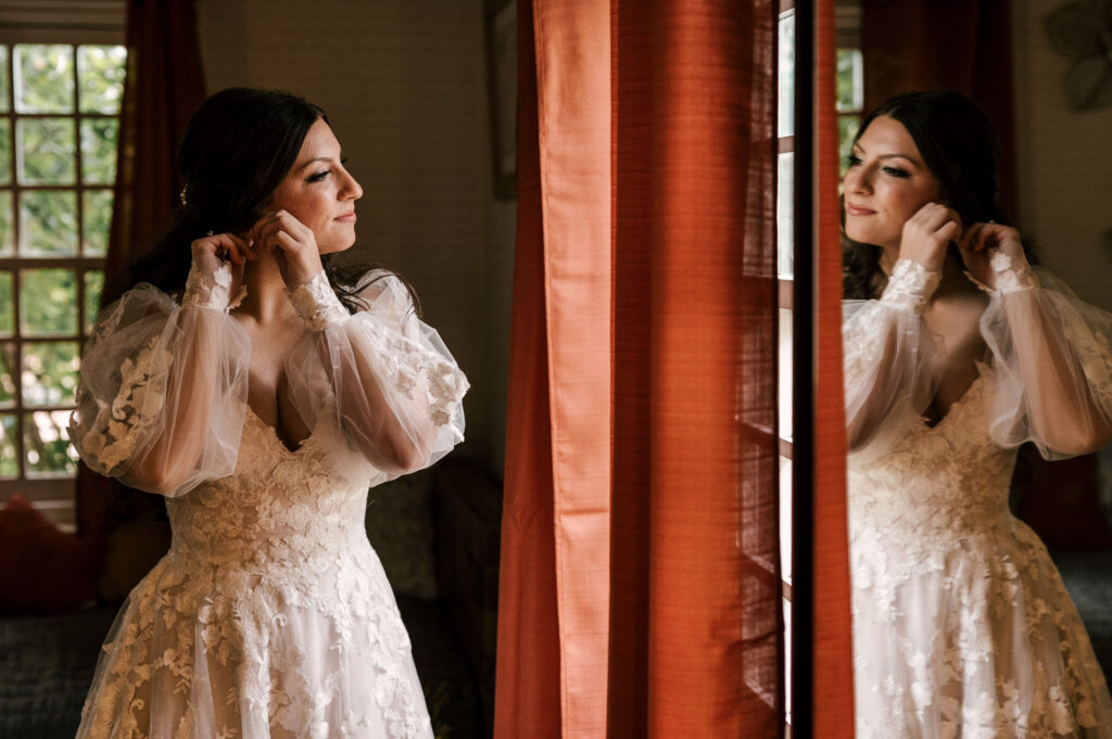 bride putting the final touches on her wedding day look at waterloo village nj wedding