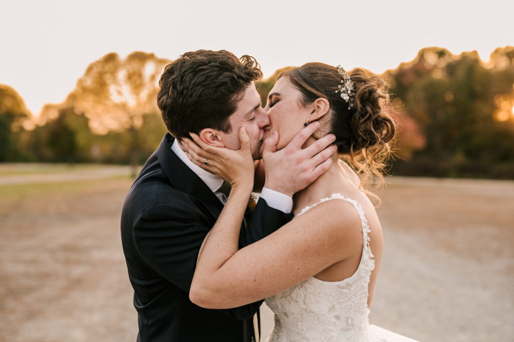 bride and groom sharing a kiss during golden hour nj fall wedding