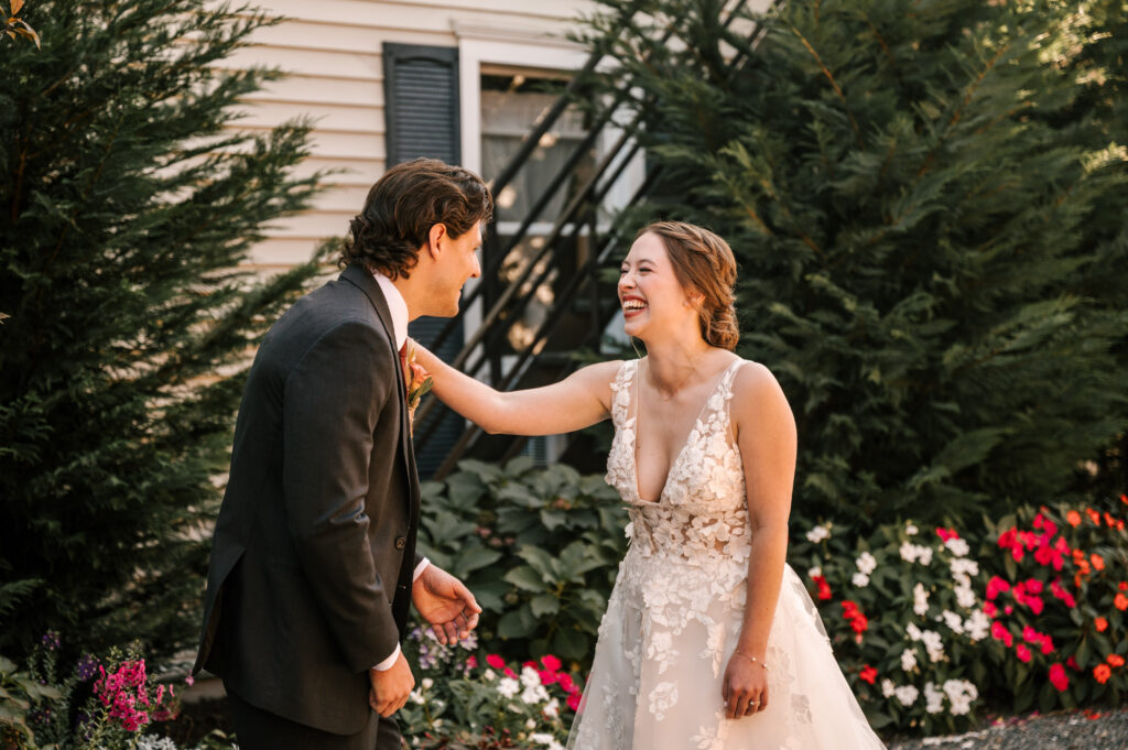 bride and groom laughing during first look at their nj fall wedding 