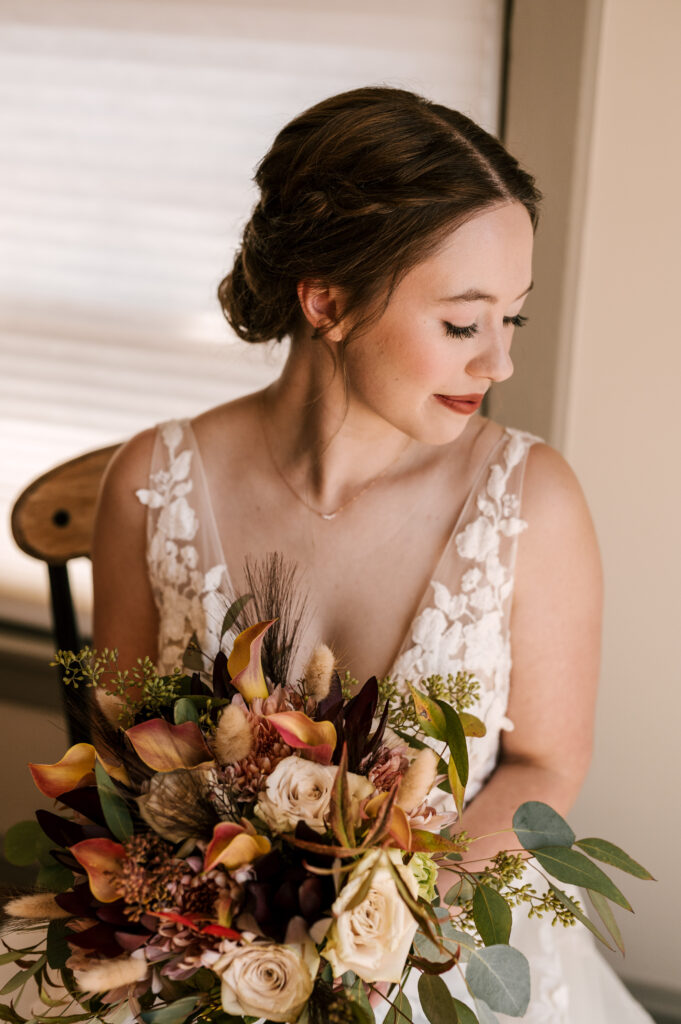 close up photo of bride and wedding day florals for fall wedding at david's country inn in nj 