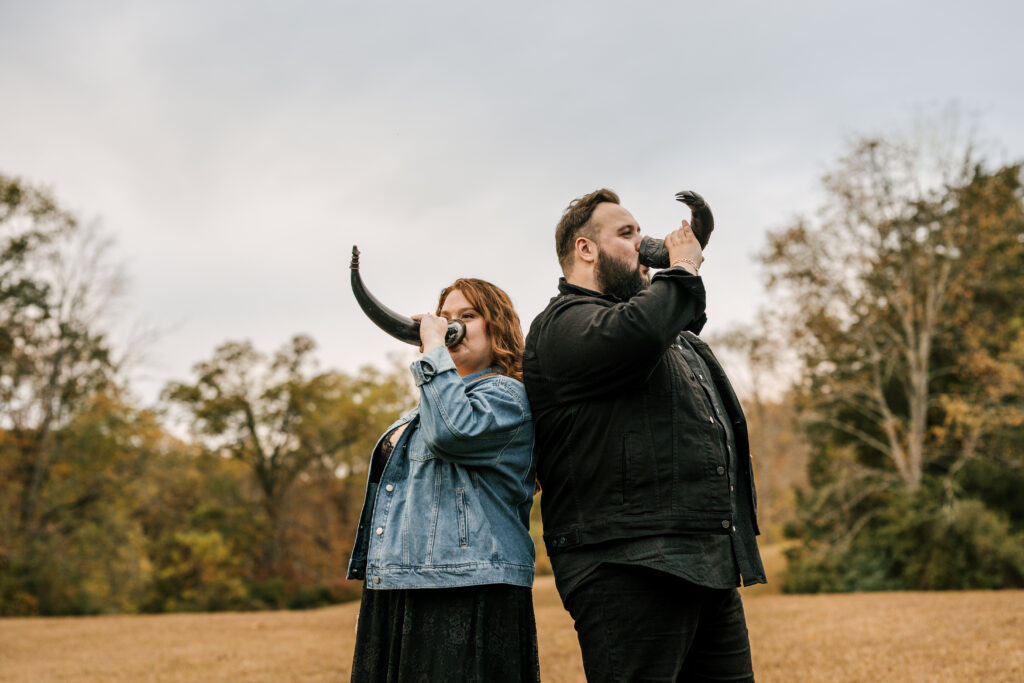 fiances drink out of viking horns at Ringwood manor