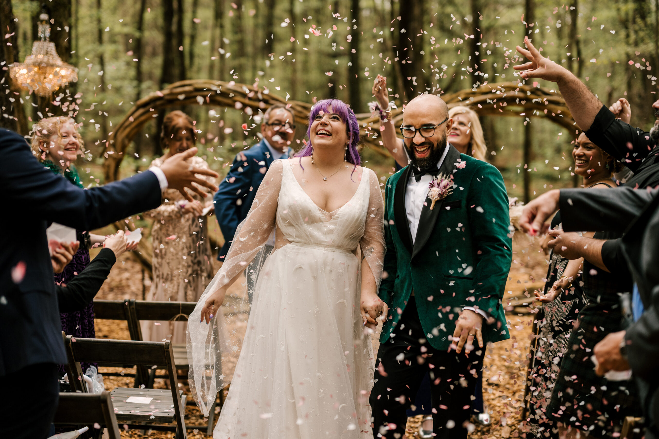 bride and groom excited and happy post-ceremony with confetti toss at Foxfire Mountainhouse forest ceremony