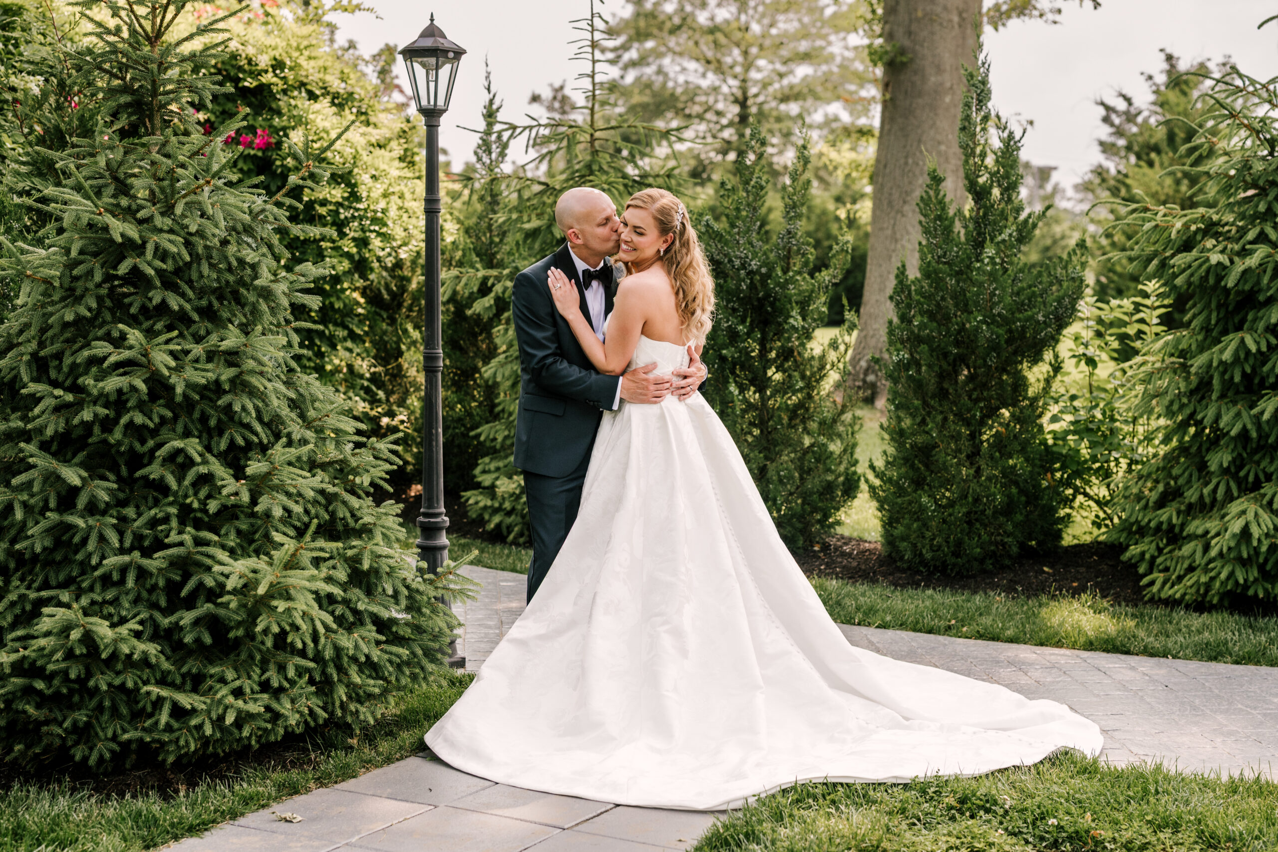 Bride and groom embracing in the courtyard of the Park Loft